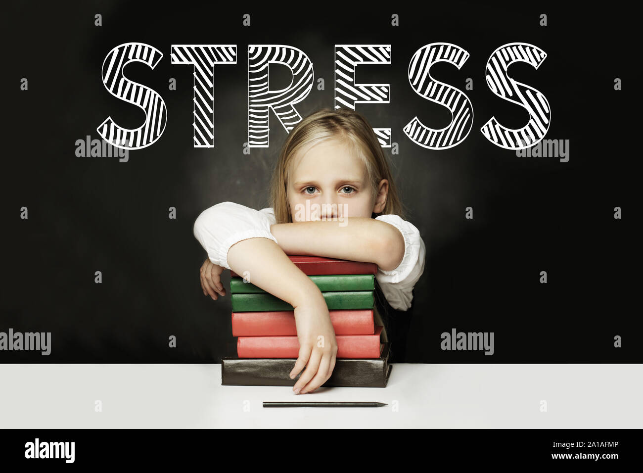 Tired child girl with books. Stress concept Stock Photo