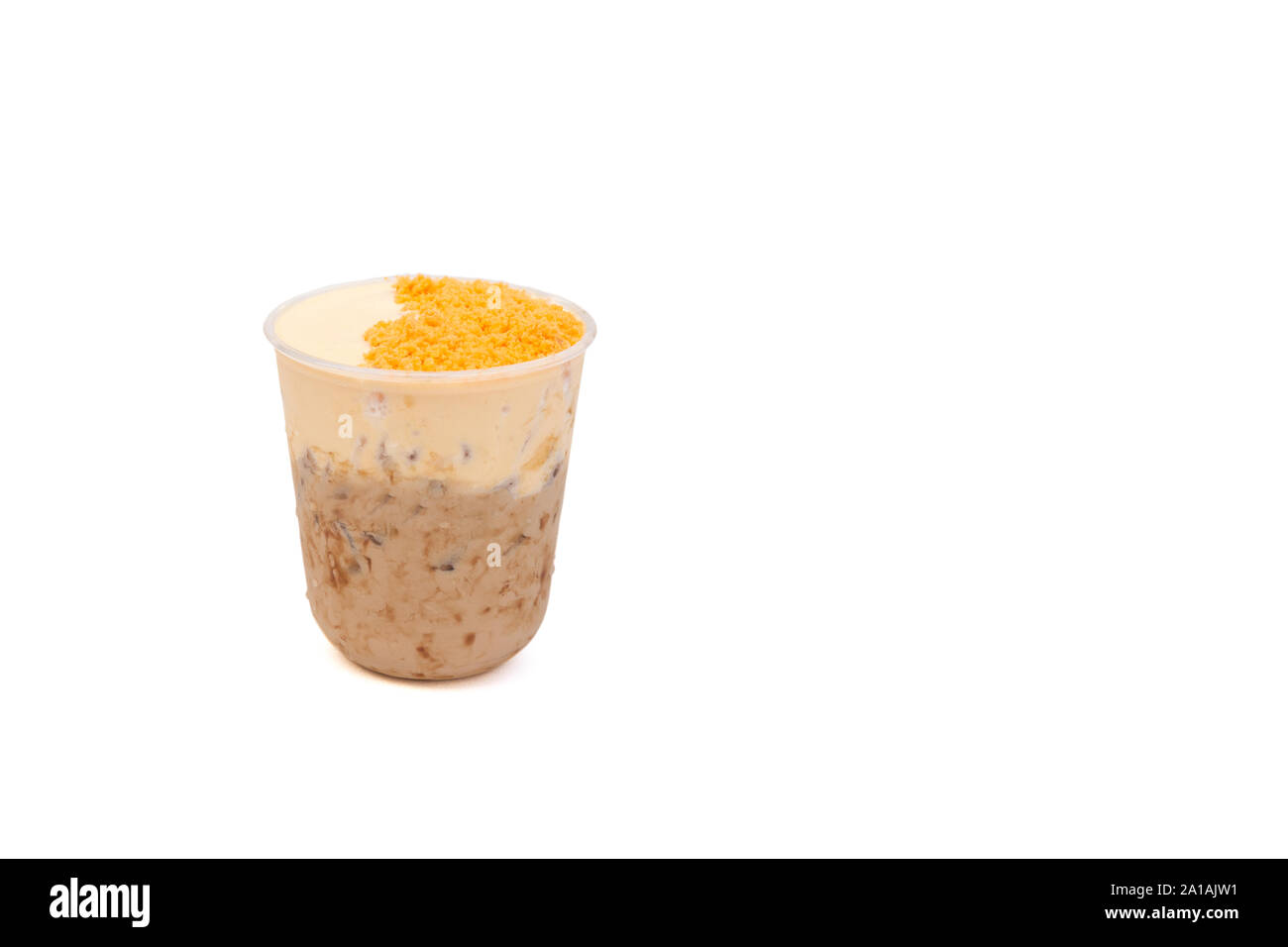 Iced milk tea with salty egg isolated in white background. Stock Photo