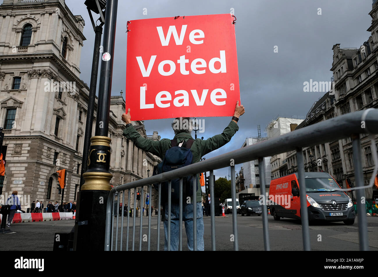 A pro brexit protester holds a placard while protesting outside Parliament while UK MP’s get back to work. Stock Photo