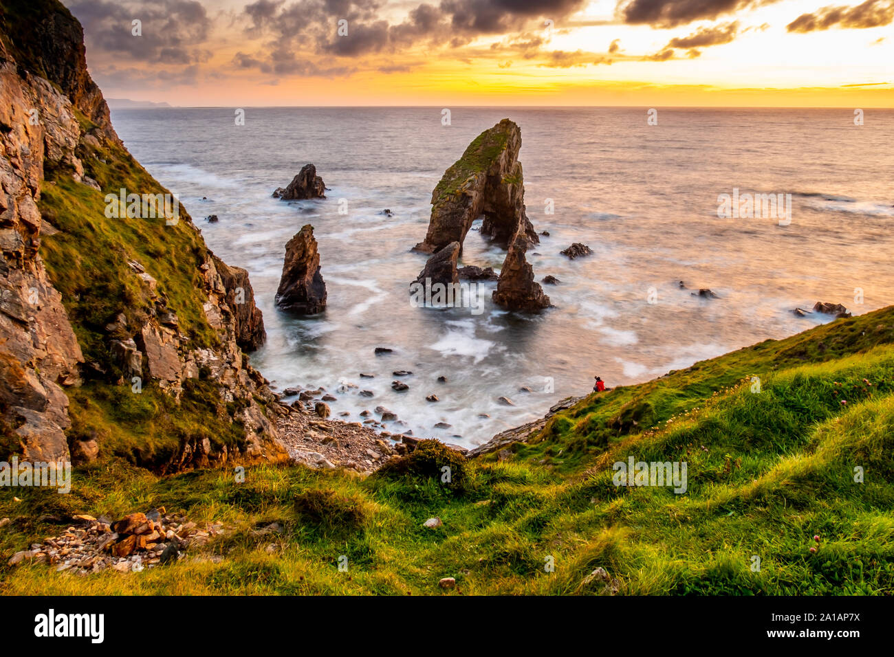 Long tme exposure of Crohy Head Sea Arch Breeches during sunset - County Donegal, Ireland. Stock Photo
