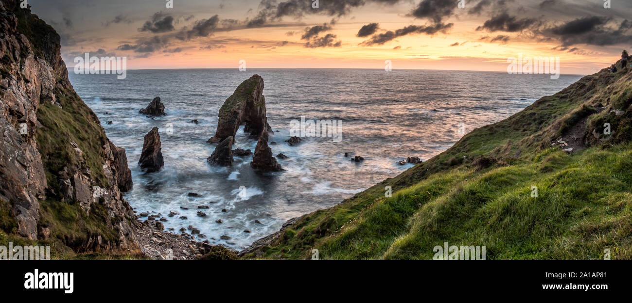 Long tme exposure of Crohy Head Sea Arch Breeches during sunset - County Donegal, Ireland. Stock Photo