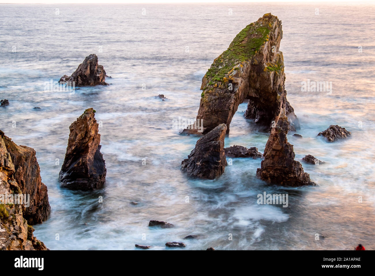 Long tme exposure of Crohy Head Sea Arch Breeches during sunset - County Donegal, Ireland. Stock Photo