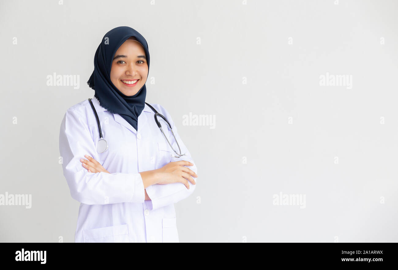 Young Arab Muslim intern doctor women smile on isolate white background ...