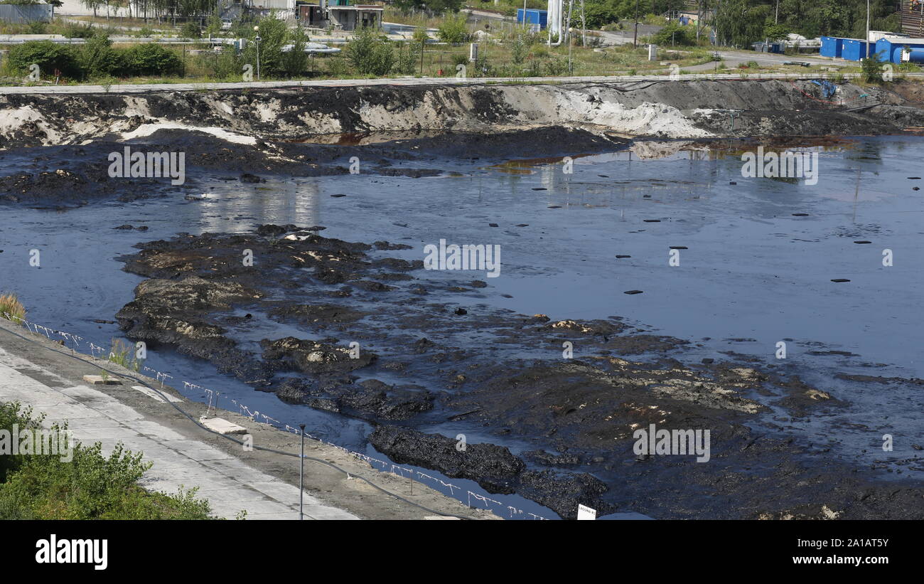 Contamination soil and water spot oil pollutions, former dump toxic waste, environmental disaster, contamination of the environment, oil lagoon Stock Photo