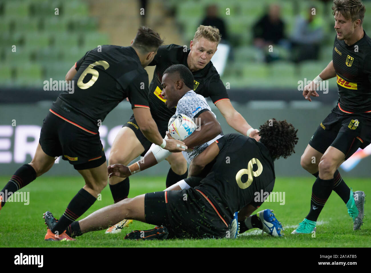 Munich, Germany. 21st Sep, 2019. Oktoberfest Sevens Rugby Tournament in Munich on 21 and 22 September 2019. Group match between Germany and Fiji. Tevita Mociu (Fiji, 8) is held by Ben Ellermann (Germany, 8), Fabian Heimpel (Germany, 6) on the left and Tim Lichtenberg (Germany, 12) in the background. Right Phil Szczesny (Germany, 5). Credit: Jürgen Kessler/dpa/Alamy Live News Stock Photo