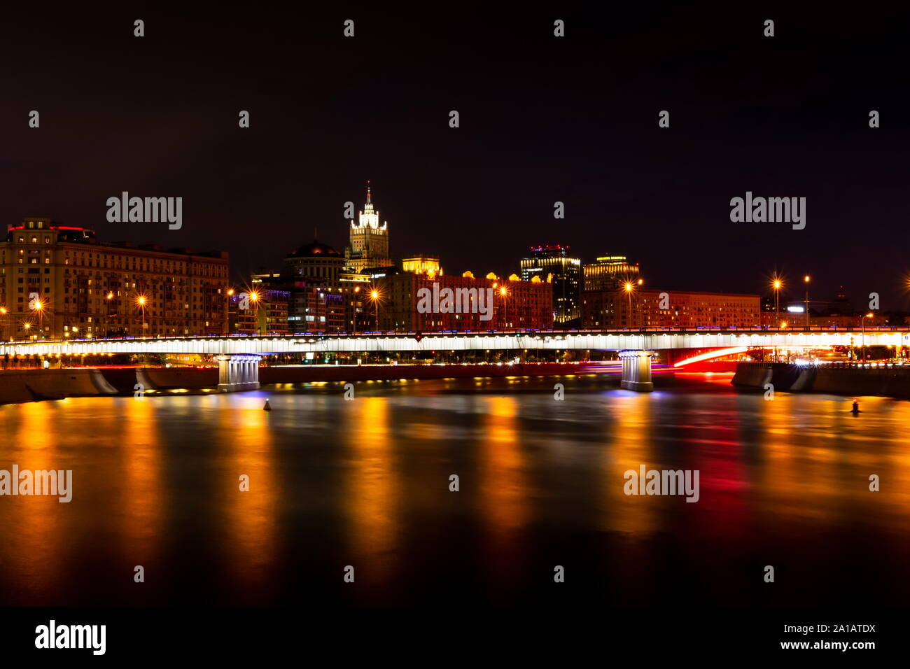 Krasnopresnenskaya embankment and Novoarbatskiy bridge. Cityscape of night Moscow. Stock Photo
