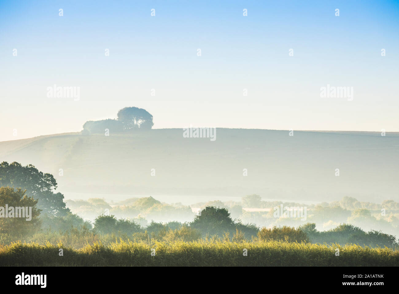 The view towards Liddington Hill near Swindon, Wiltshire on an early autumn sunrise. Stock Photo