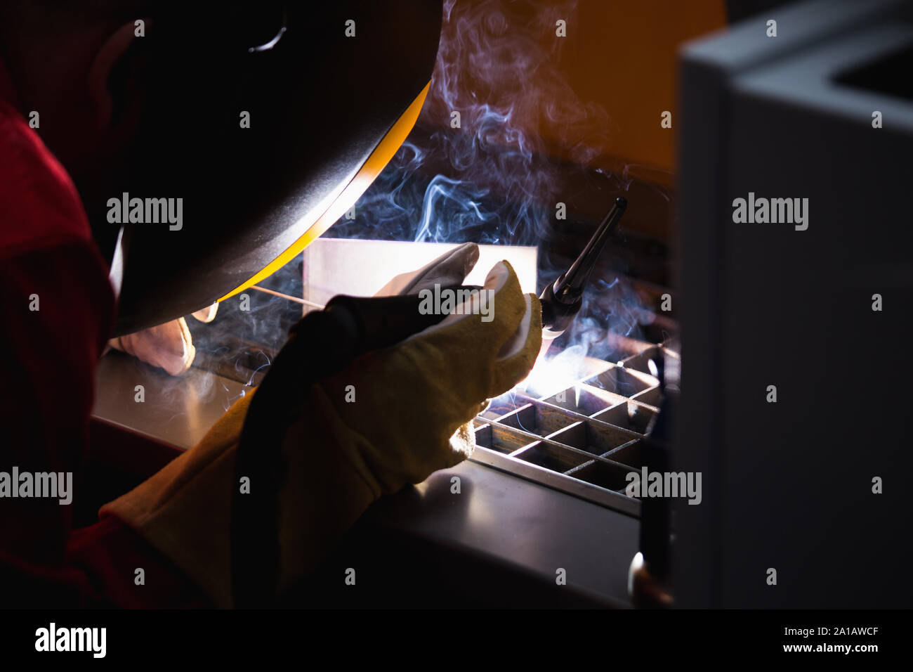 Welder at the factory at work Stock Photo