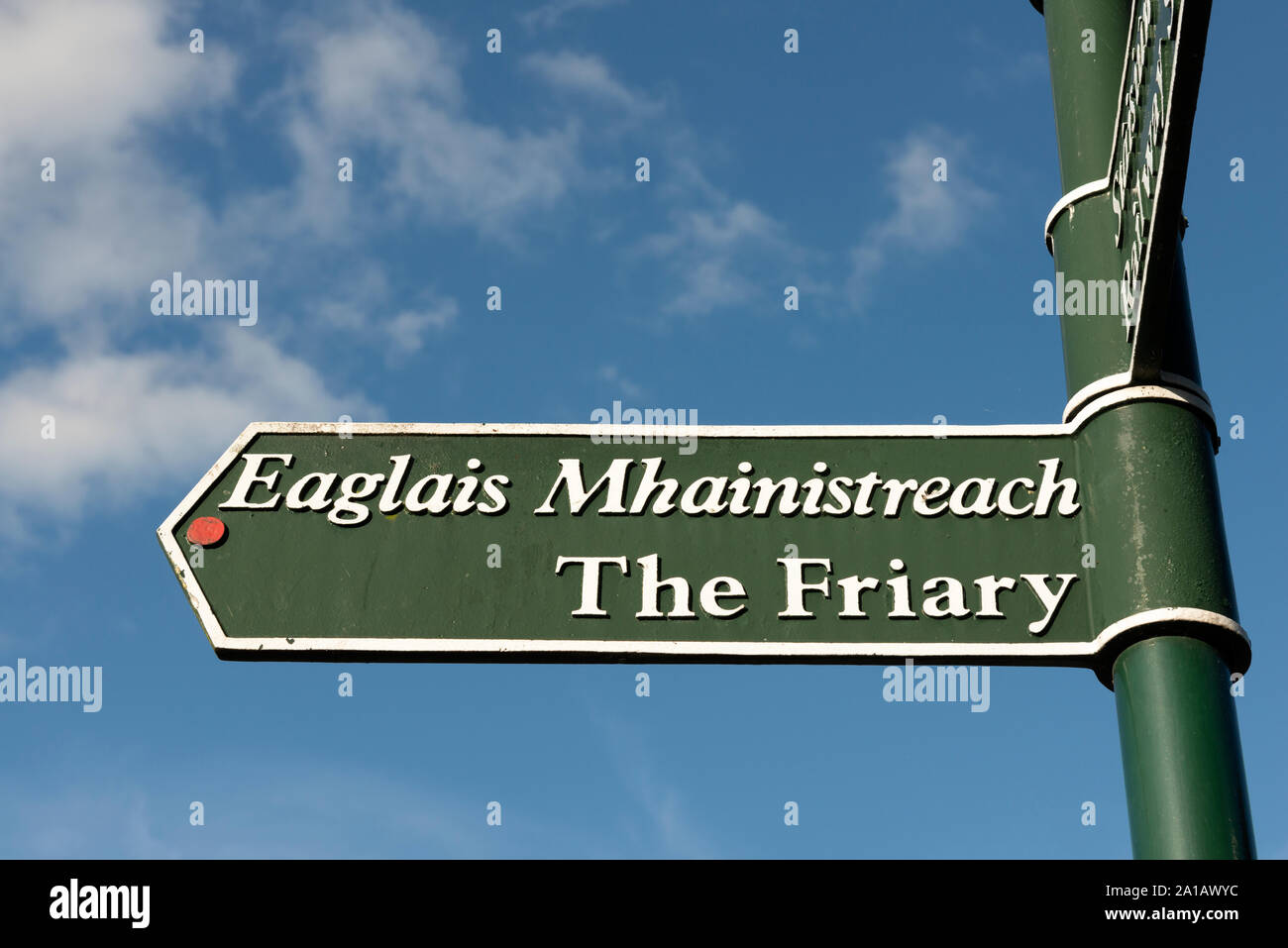 The Friary bilingual fingerpost directional sign and tourist information in Killarney, County Kerry, Ireland Stock Photo
