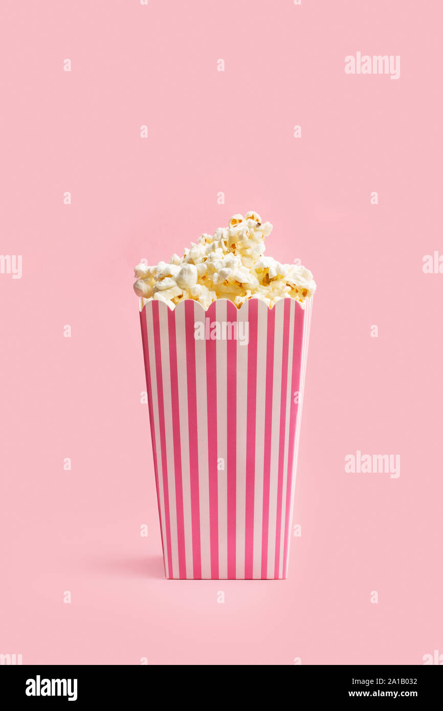 Popcorn in buckets on a pink background Stock Photo