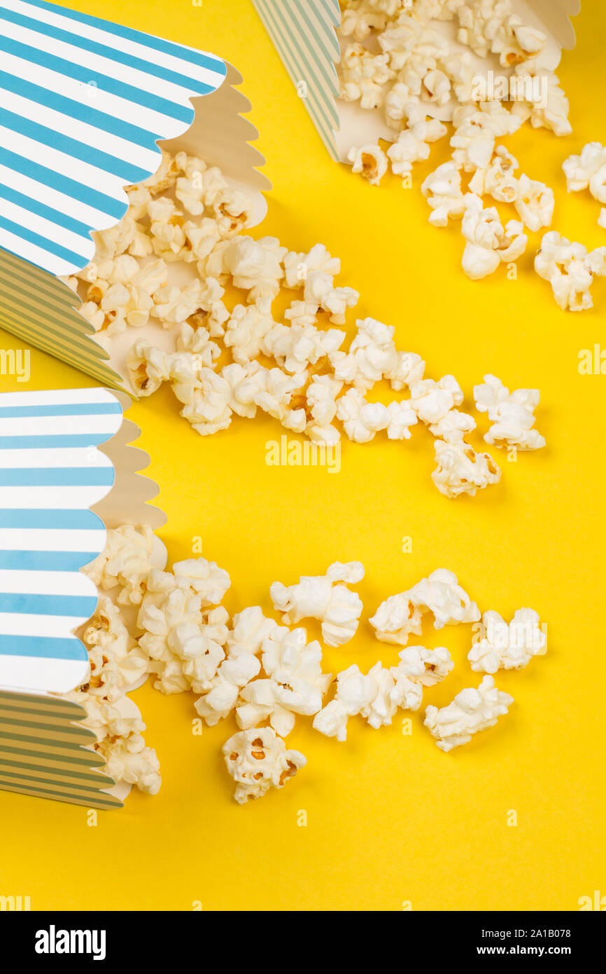 Popcorn in buckets on a yellow background Stock Photo