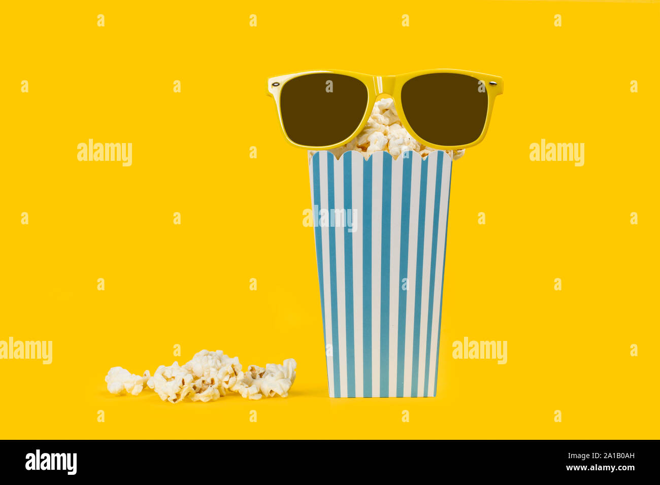 Popcorn in buckets on a yellow background Stock Photo