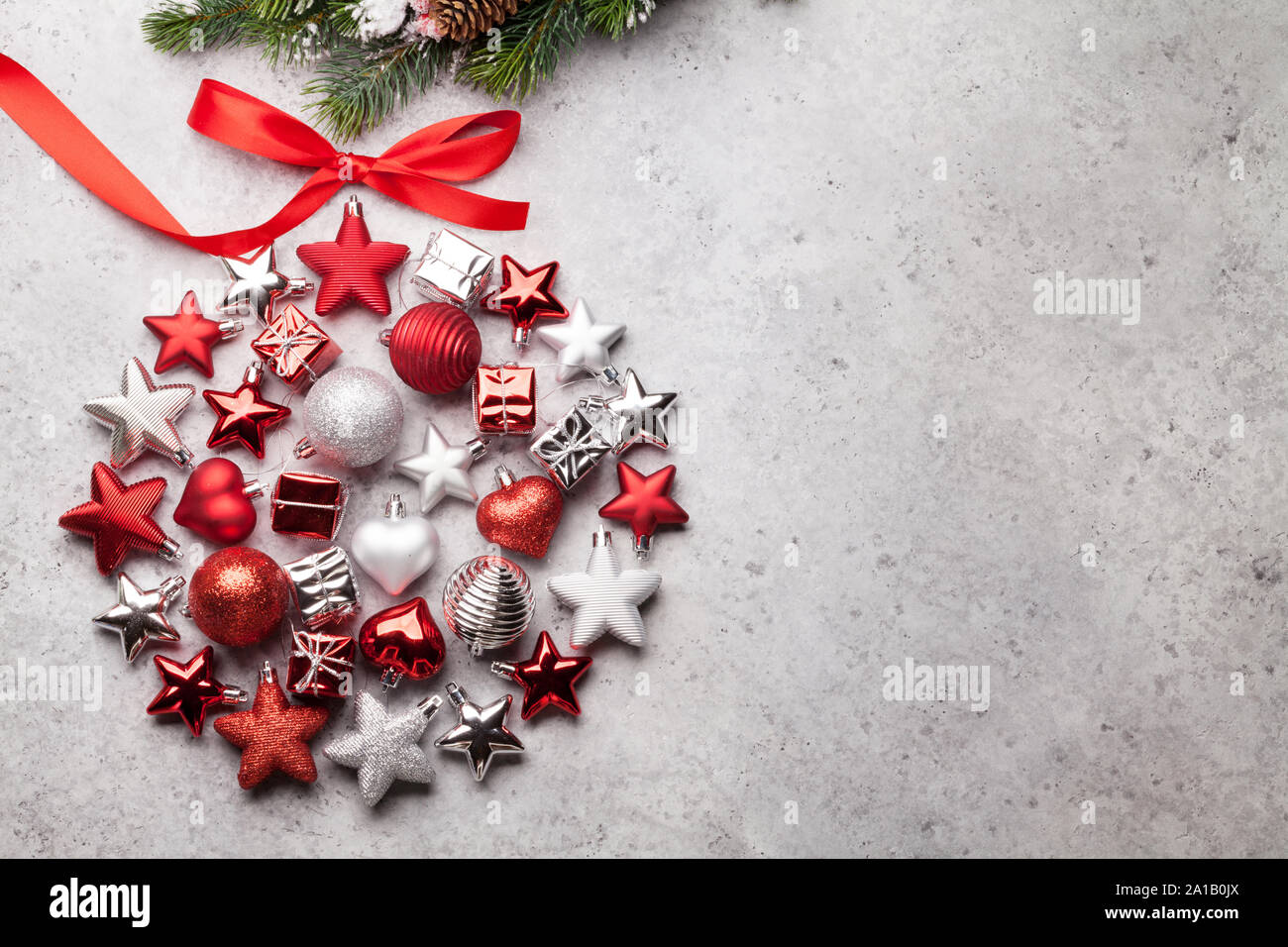 Christmas greeting card with decor and fir tree branch covered by snow ...