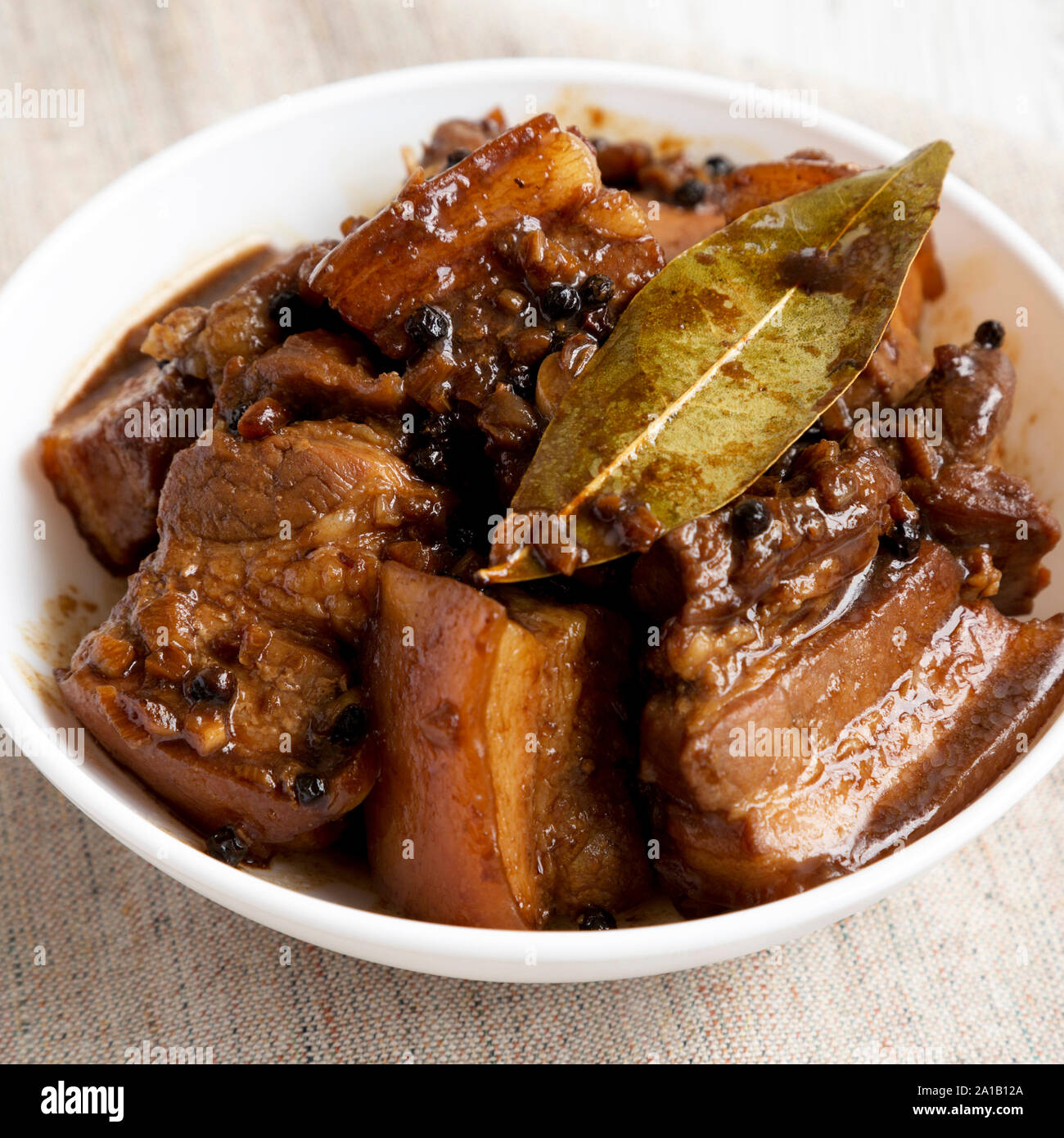 Homemade Filipino Adobo Pork in a bowl, low angle view. Closeup Stock