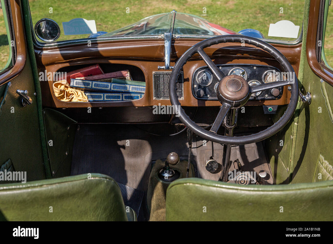 Interior view of the dashboard, steering wheel, pedals and gear stick  of an Austin Seven, vintage British economy car. Stock Photo