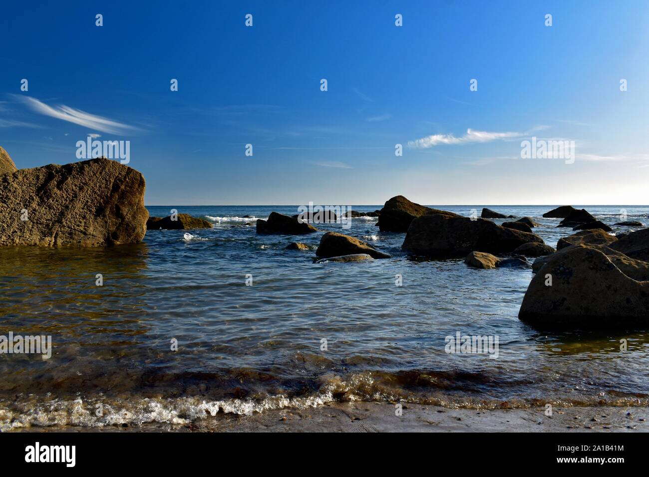 Evening low tide on Porth Ysgo beach. Stock Photo