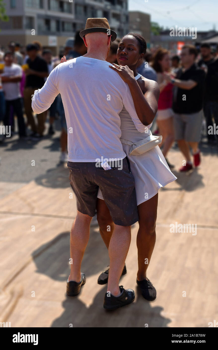 Couple dancing alone. Photo taken at the Toronto Pride Festival (2019) Stock Photo