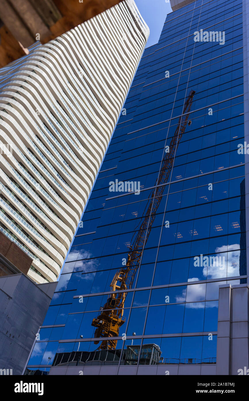 Shot of crane reflected in skyscraper, downtown Toronto, Ontario