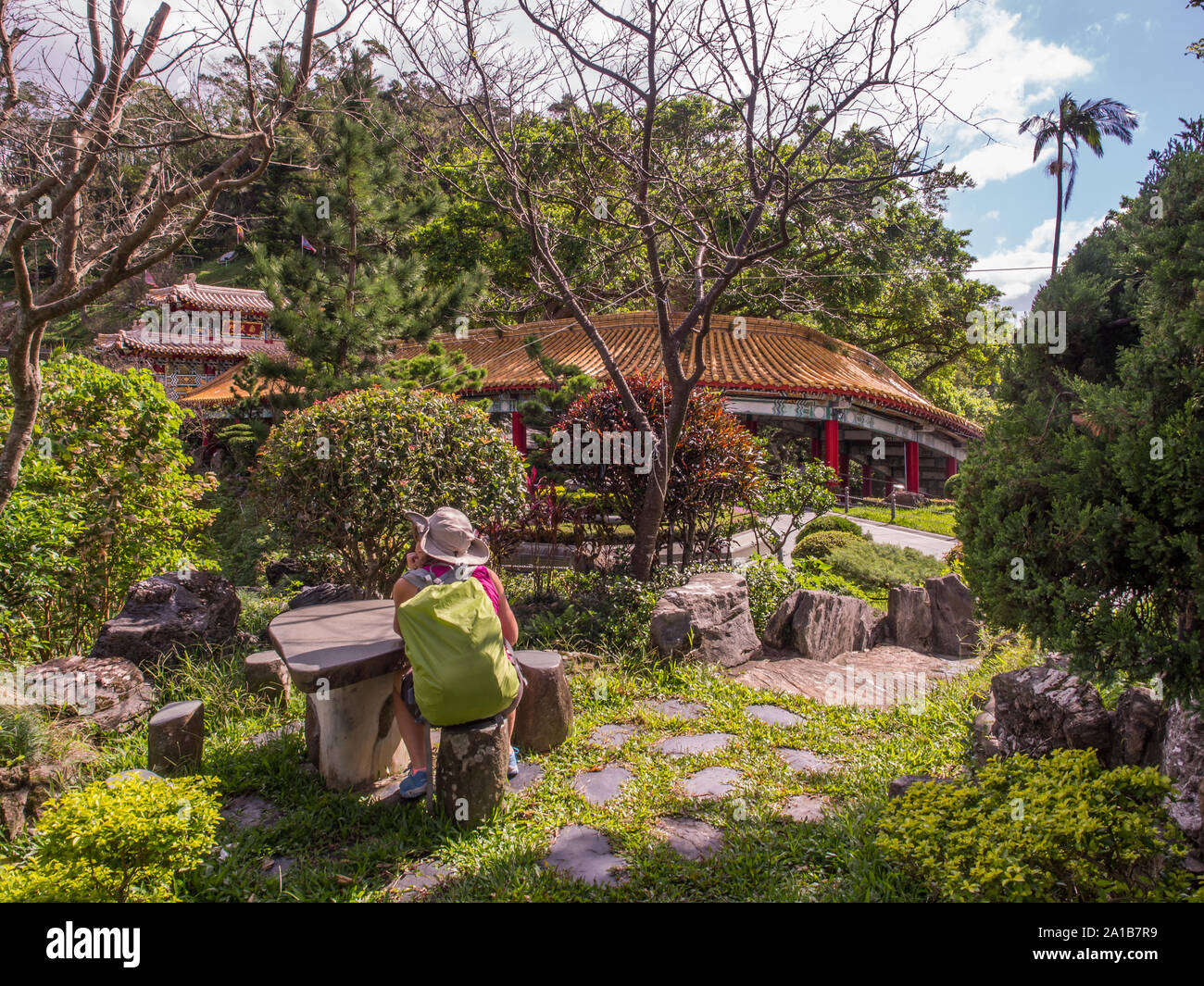 Maokong, Taiwan - October 19, 2016: Women with racksack in the park of  the Chih Nan Temple on the hills of Maokong  in Taiwan. Asia Stock Photo