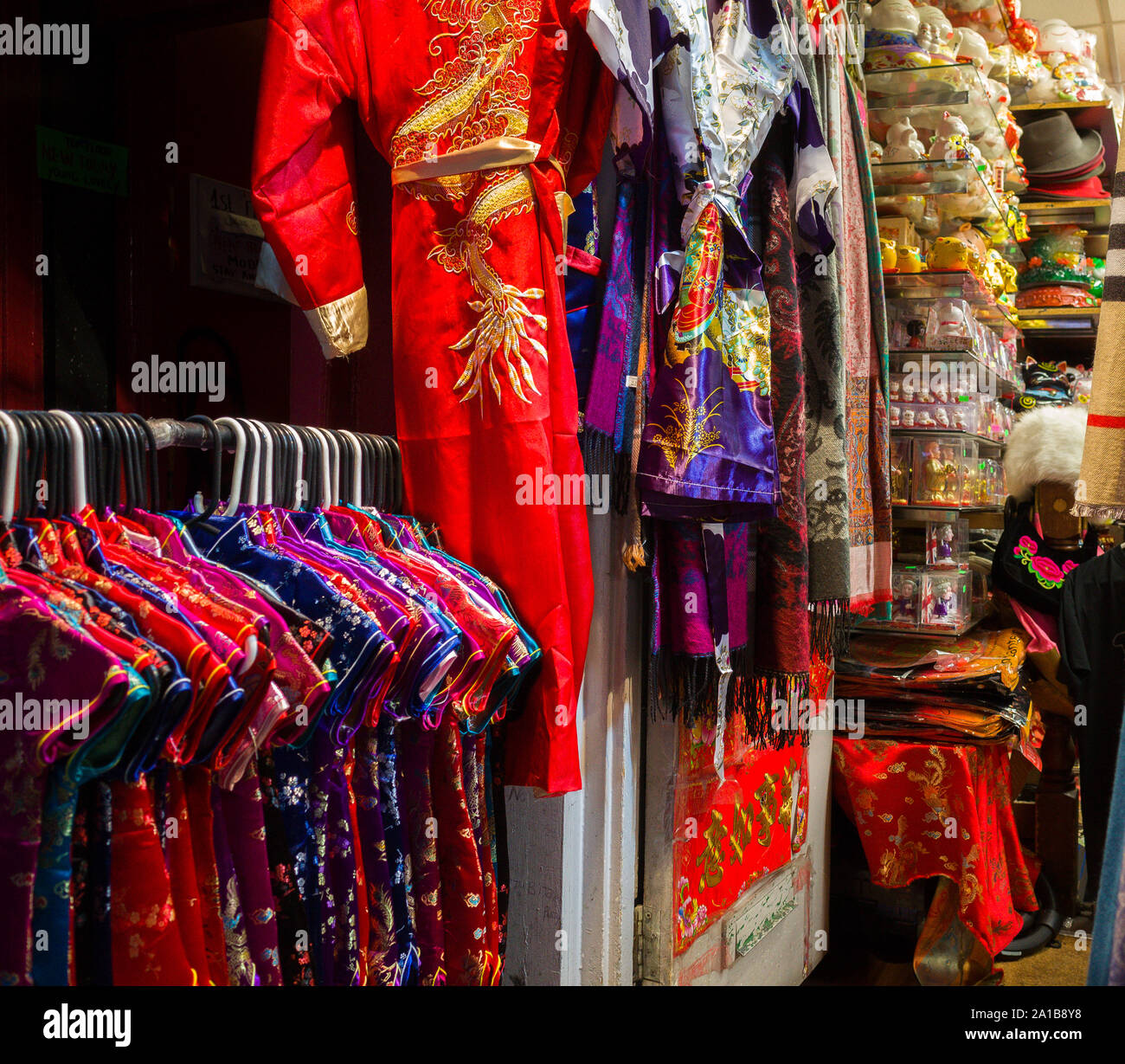 An oriental shop selling clothing, fabric and various ornaments. Stock Photo