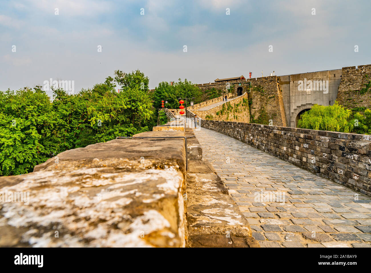 Nanjing Chengqiang Ming City Wall Leading Lines with Walking People During Afternoon Sunset Stock Photo
