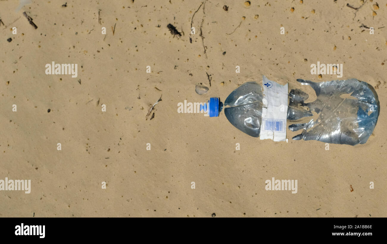 Plastic bottle thrown on a beach Stock Photo Alamy