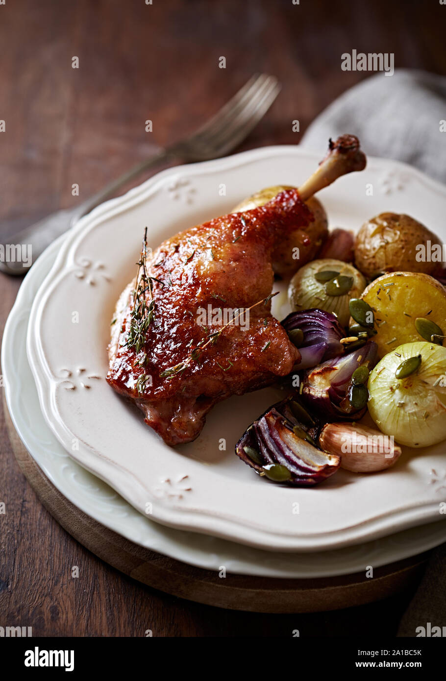 Ovenroasted duck legs and vegetables (autumn style Stock Photo Alamy