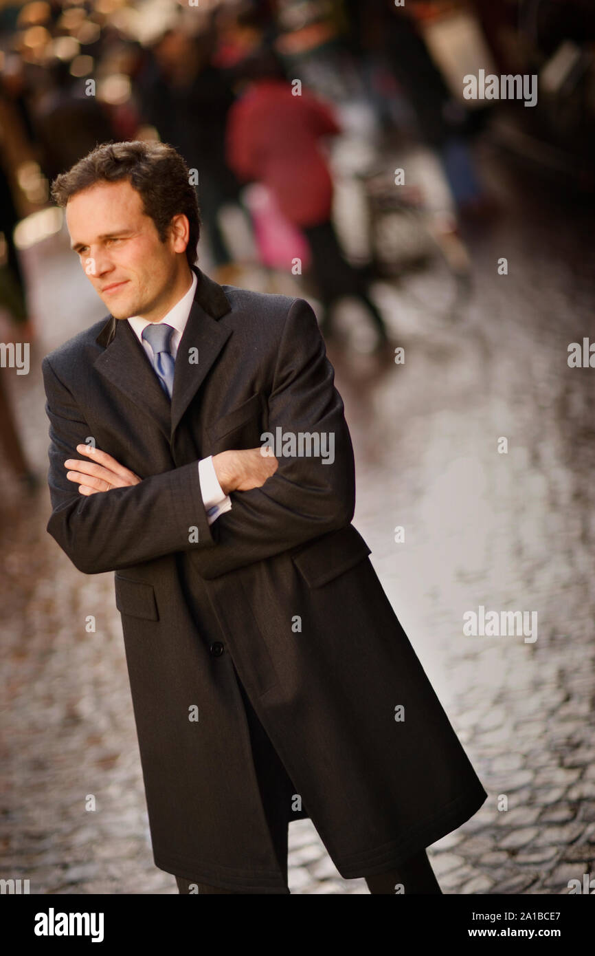 Young man with his arms crossed Stock Photo - Alamy