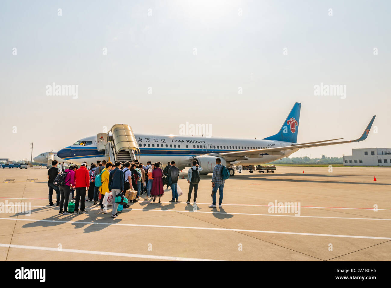 At Nanjing Lukou Airport Passengers are Waiting Outside for Boarding the China Southern Airlines Plane Stock Photo