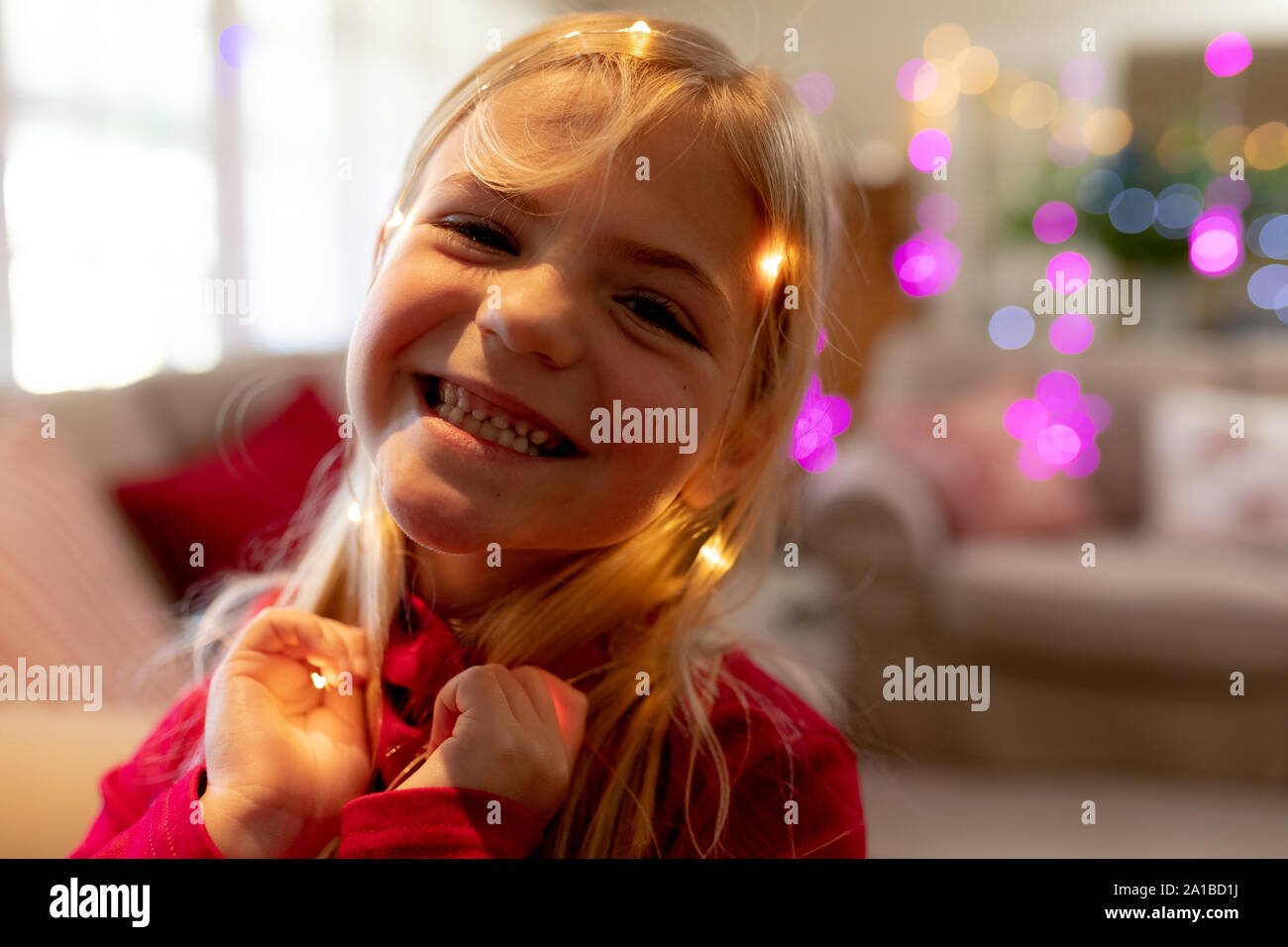 Girl at home at Christmas time Stock Photo