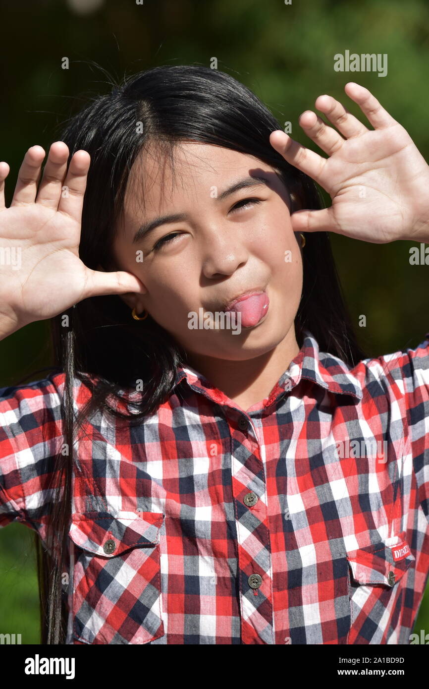 A Preteen Making Funny Faces Stock Photo