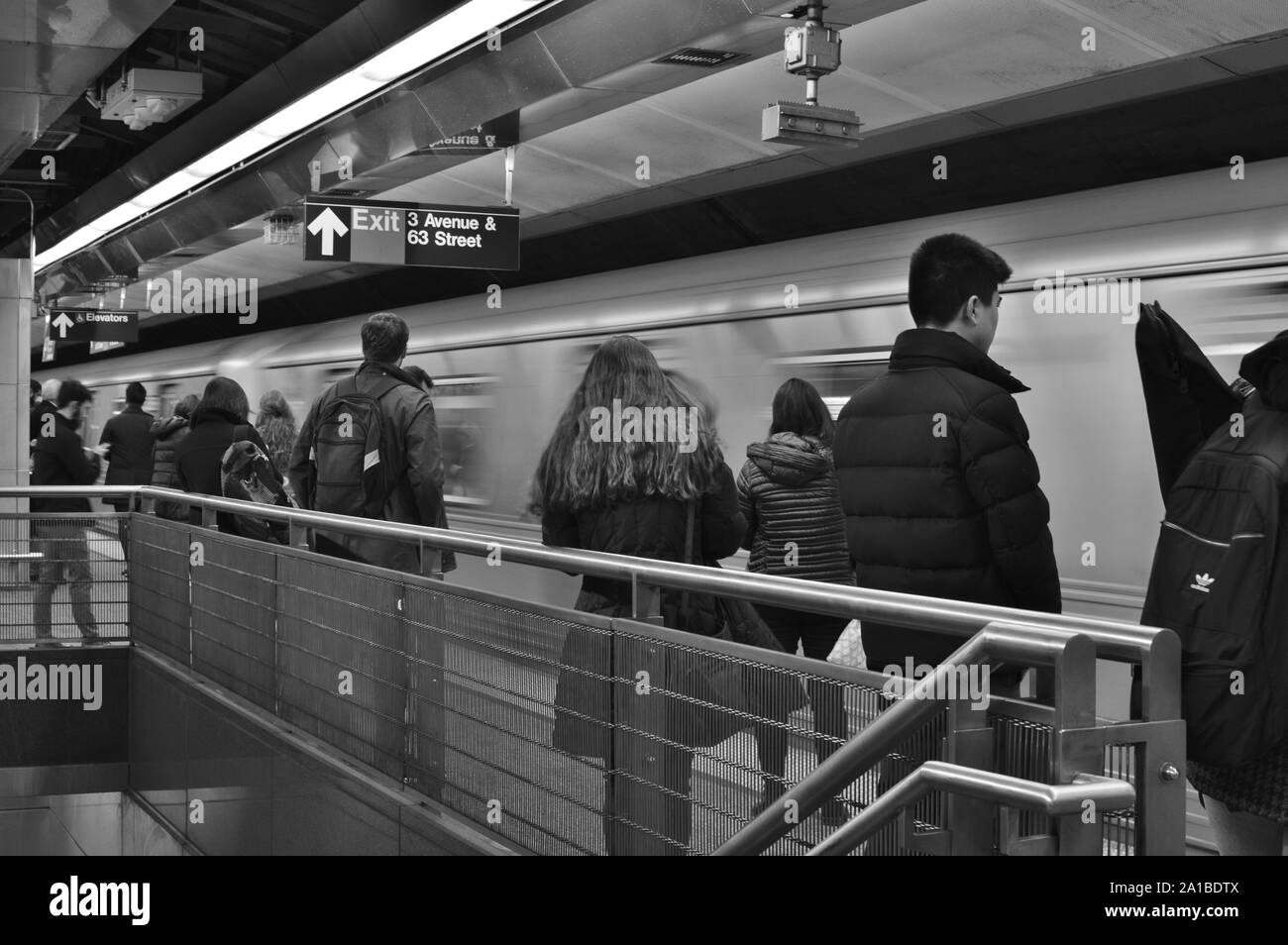 NYC Commuters Waiting for New York City MTA Subway on Train Station Platform Metro Transit Stock Photo