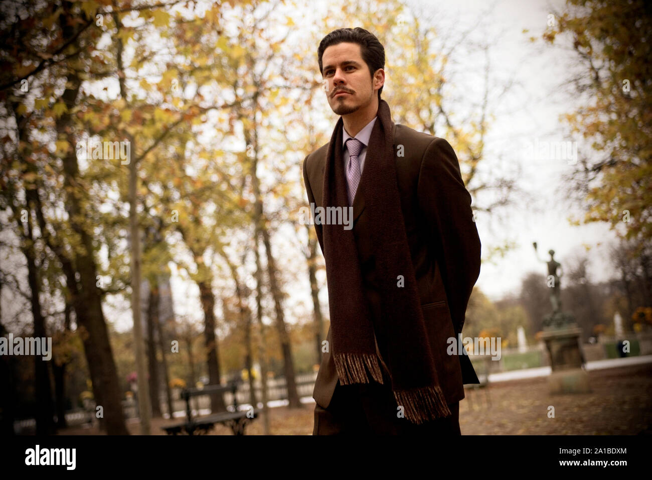 Mid adult man walking in a park. Stock Photo