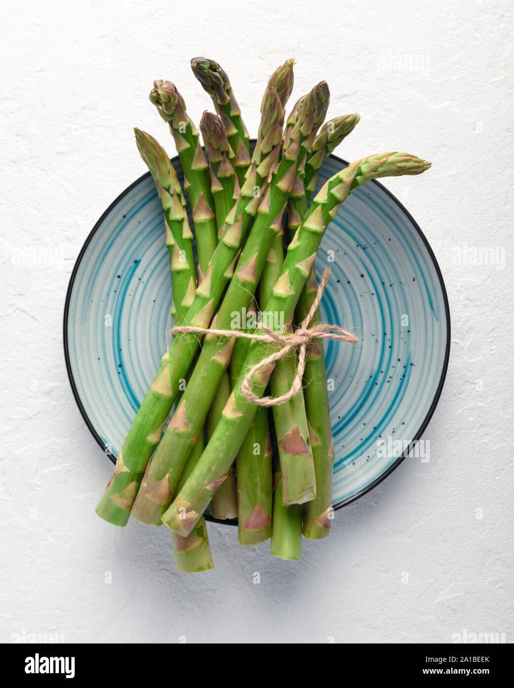Download Green Asparagus Sprout On Blue Plate Top View Food Photography Stock Photo Alamy Yellowimages Mockups