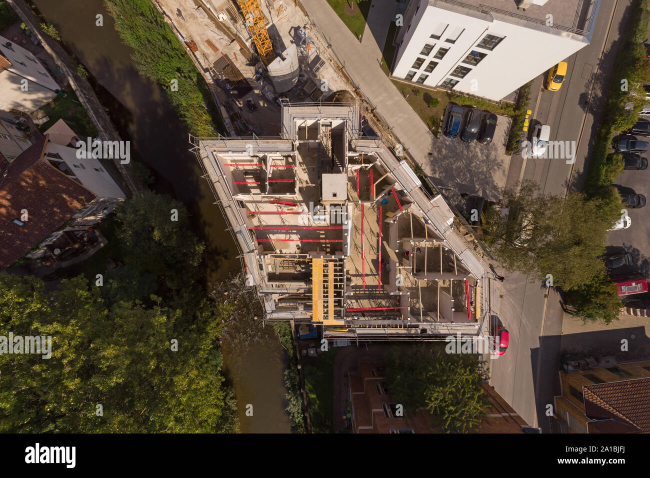 50 m aerial view of construction site of an apartment building in shell construction state. Stock Photo