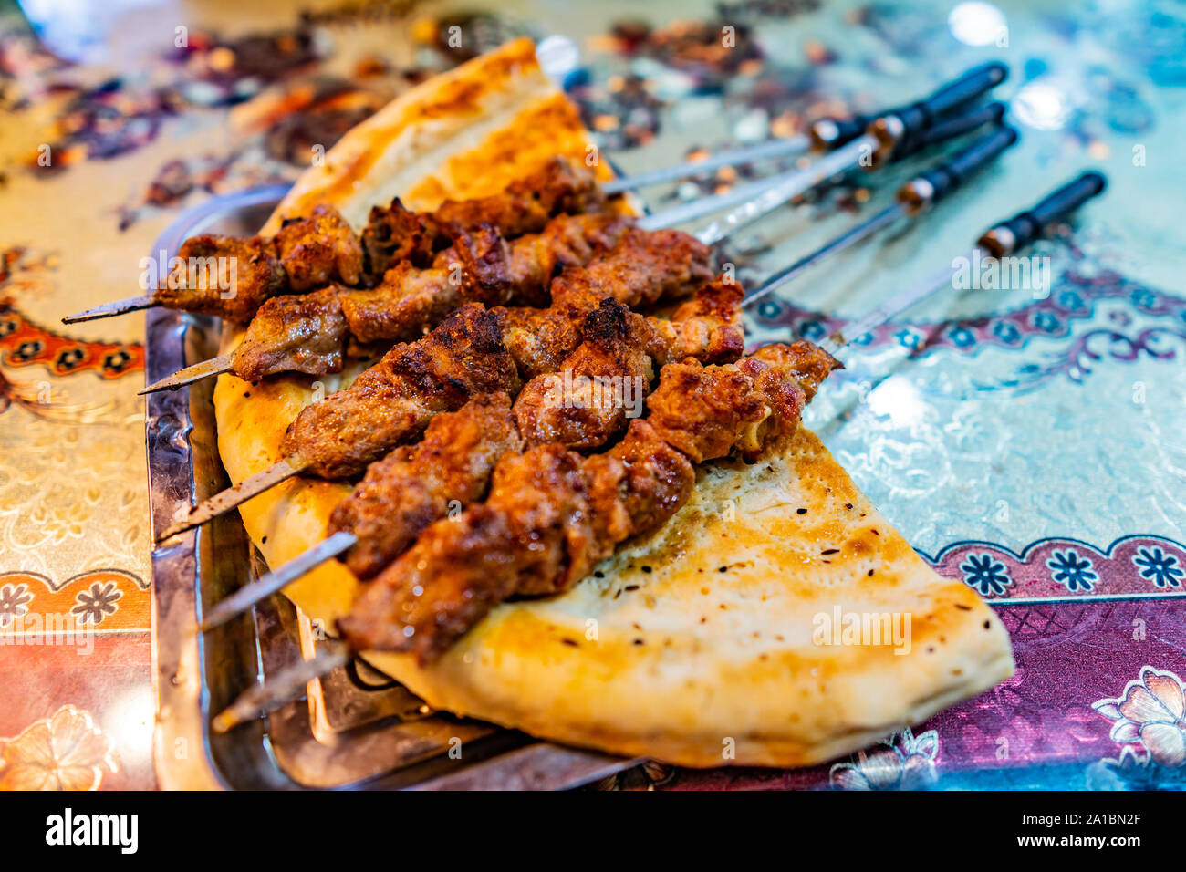 Uyghur Five Traditional Hot Spicy Lamb Skewers with Cumin Laying on a