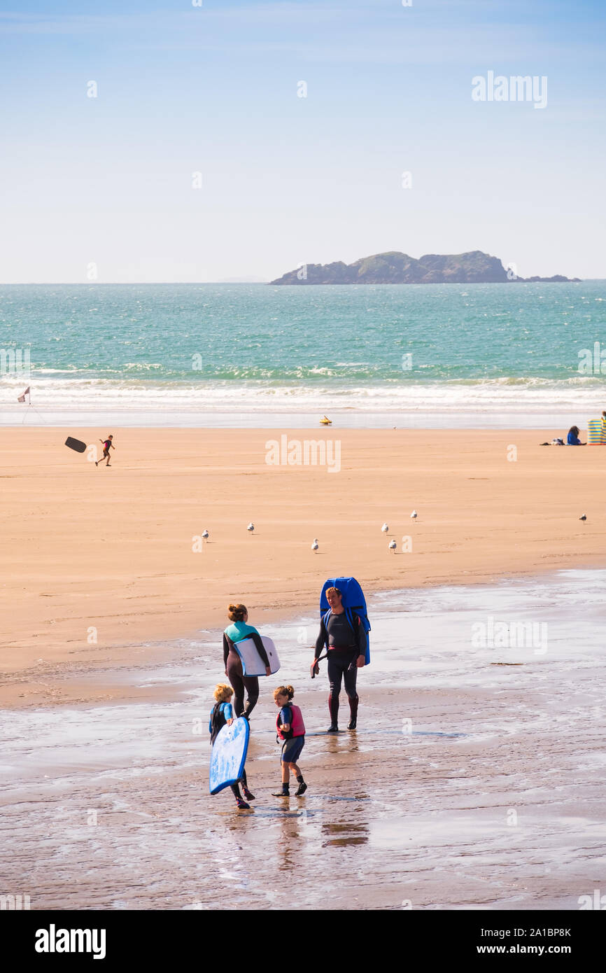 People enjoying the sunshine on Broad Haven beach on the coast of St Bride's Bay, Pembrokeshire National Park, South West Wales UK Stock Photo