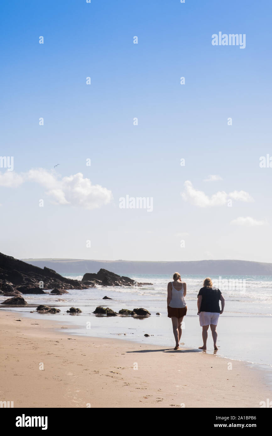 Summer holidays in the UK: People on the sandy beach at Nolton Haven on the coast of St Bride's Bay, Pembrokeshire National Park, South West Wales UK Stock Photo