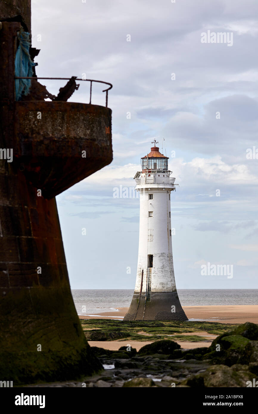 tied out New Brighton beach  Wallasey  landmark decommissioned lighthouse  River Mersey  Liverpool Bay  known locally as Perch Rock Stock Photo