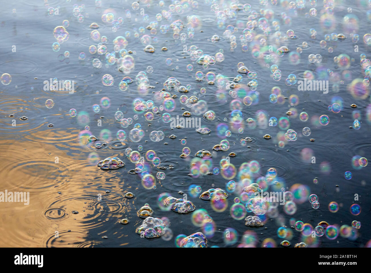Childrens bubbles over water Stock Photo