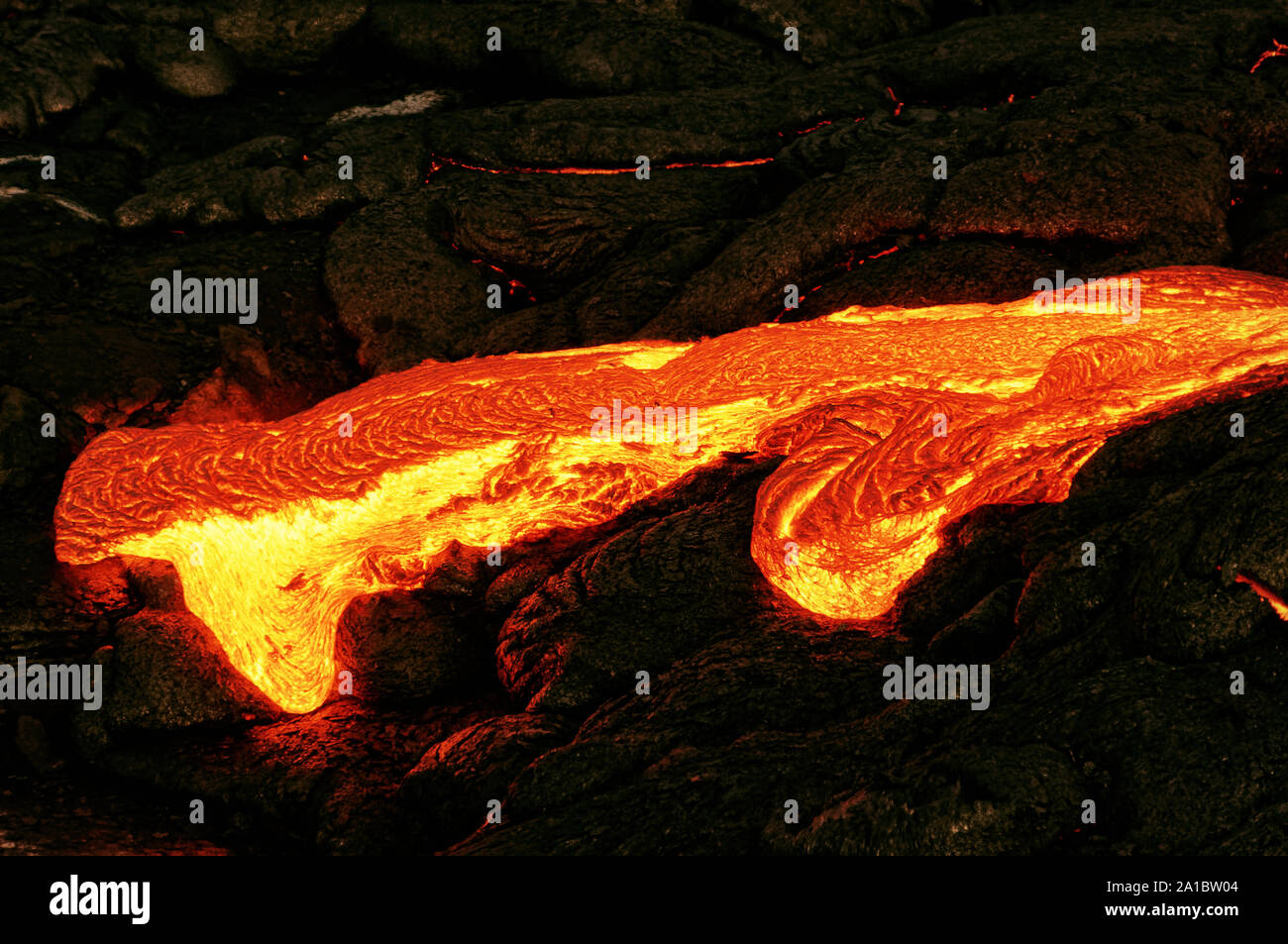 Hot magma escapes from an earth column as part of an active lava flow