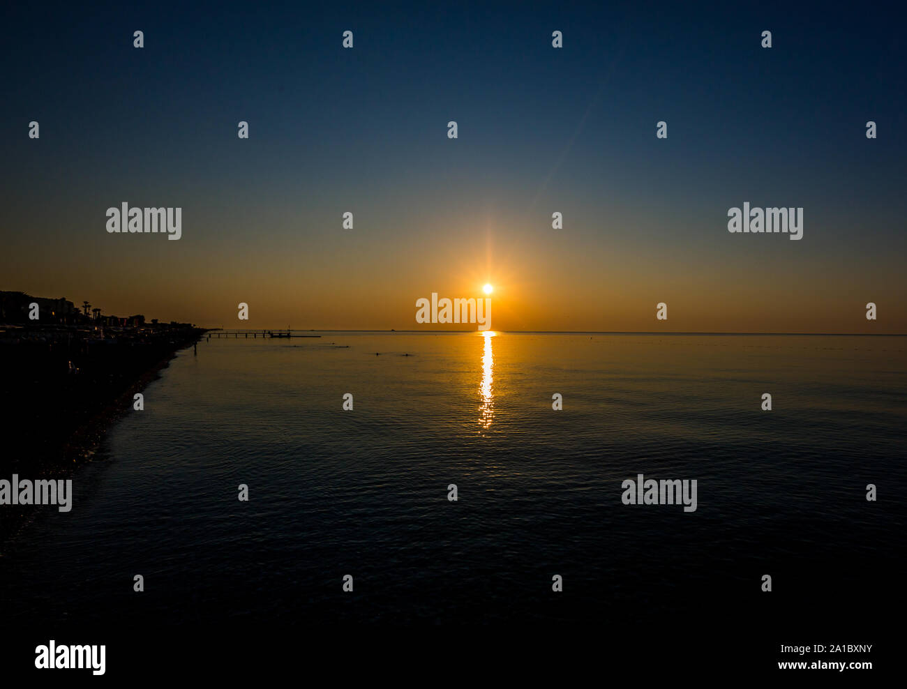 Beautiful sunrise over the horizon in the sea Stock Photo - Alamy