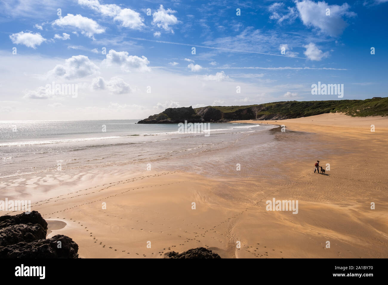 Travel and tourism : People enjoying a late summer afternoon on the golden sands at Broadhaven South beach and coastline, Pembrokeshire , south west Wales UK Stock Photo