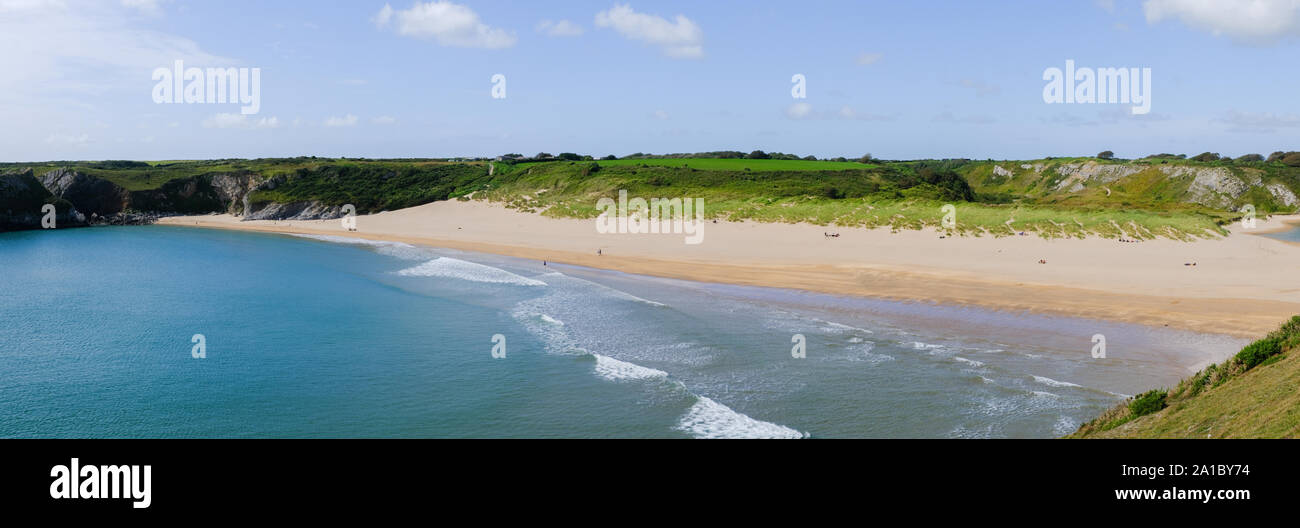 Travel and tourism : People enjoying a late summer afternoon on the golden sands at Broadhaven South beach and coastline, Pembrokeshire , south west Wales UK Stock Photo