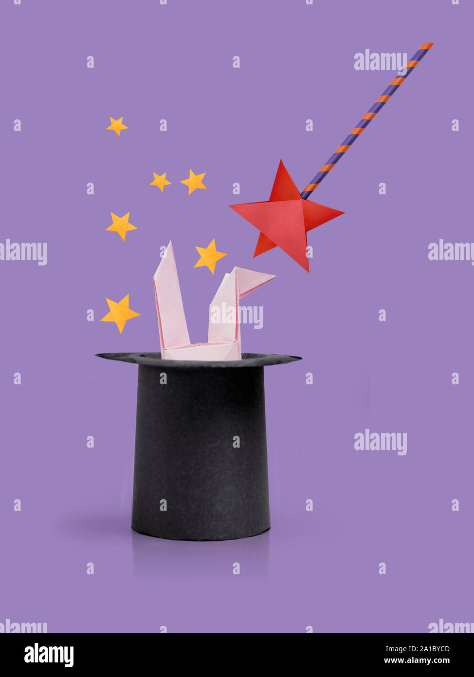 Magic wand with rabbit ears in cylinder hat Stock Photo