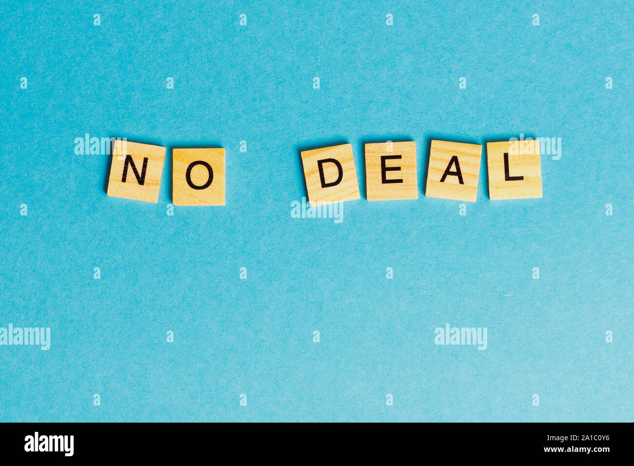 the English words - no deal - laid with wooden letters on a blue background Stock Photo