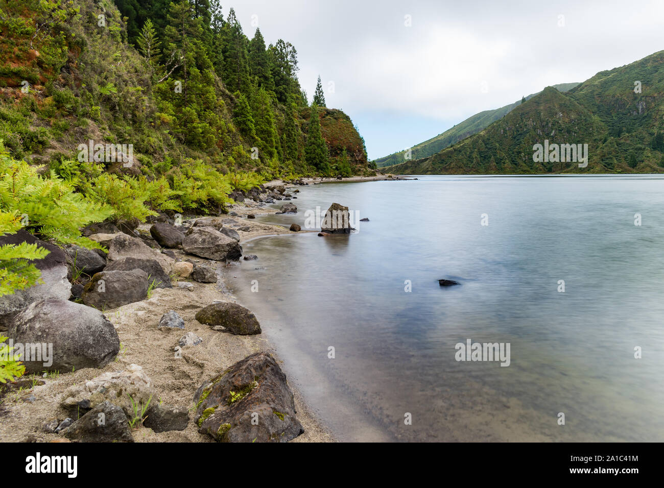 View from the waterside of Lagoa do Fogo, a crater lake on the island of São Miguel in the Azores archipelago.  Long exposure image. Stock Photo