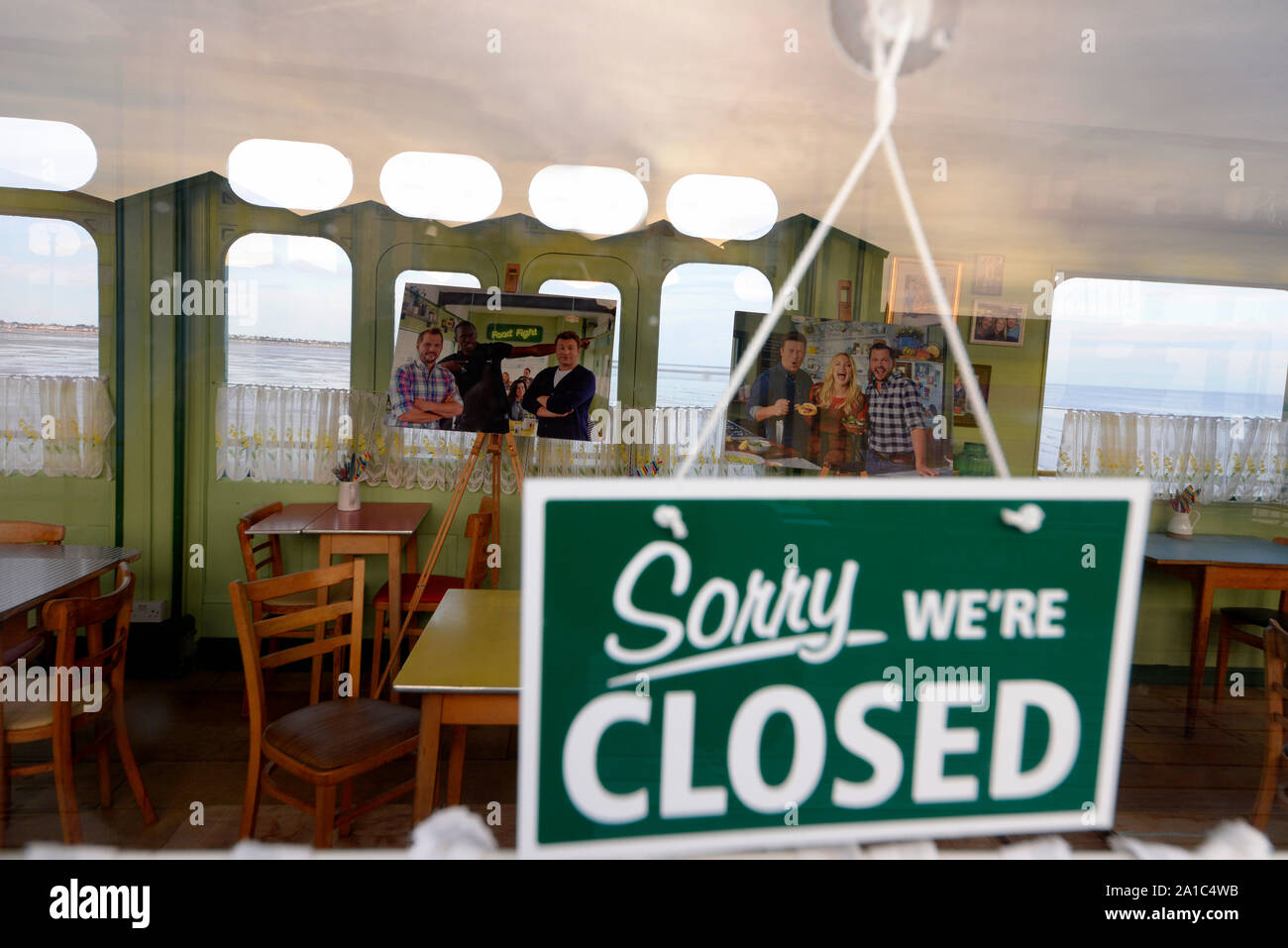 Closed sign on door of Jamie and Jimmy's cafe for filming the tv program with Jamie Oliver and Jimmy Doherty on Southend Pier, Essex, UK. Huts Stock Photo