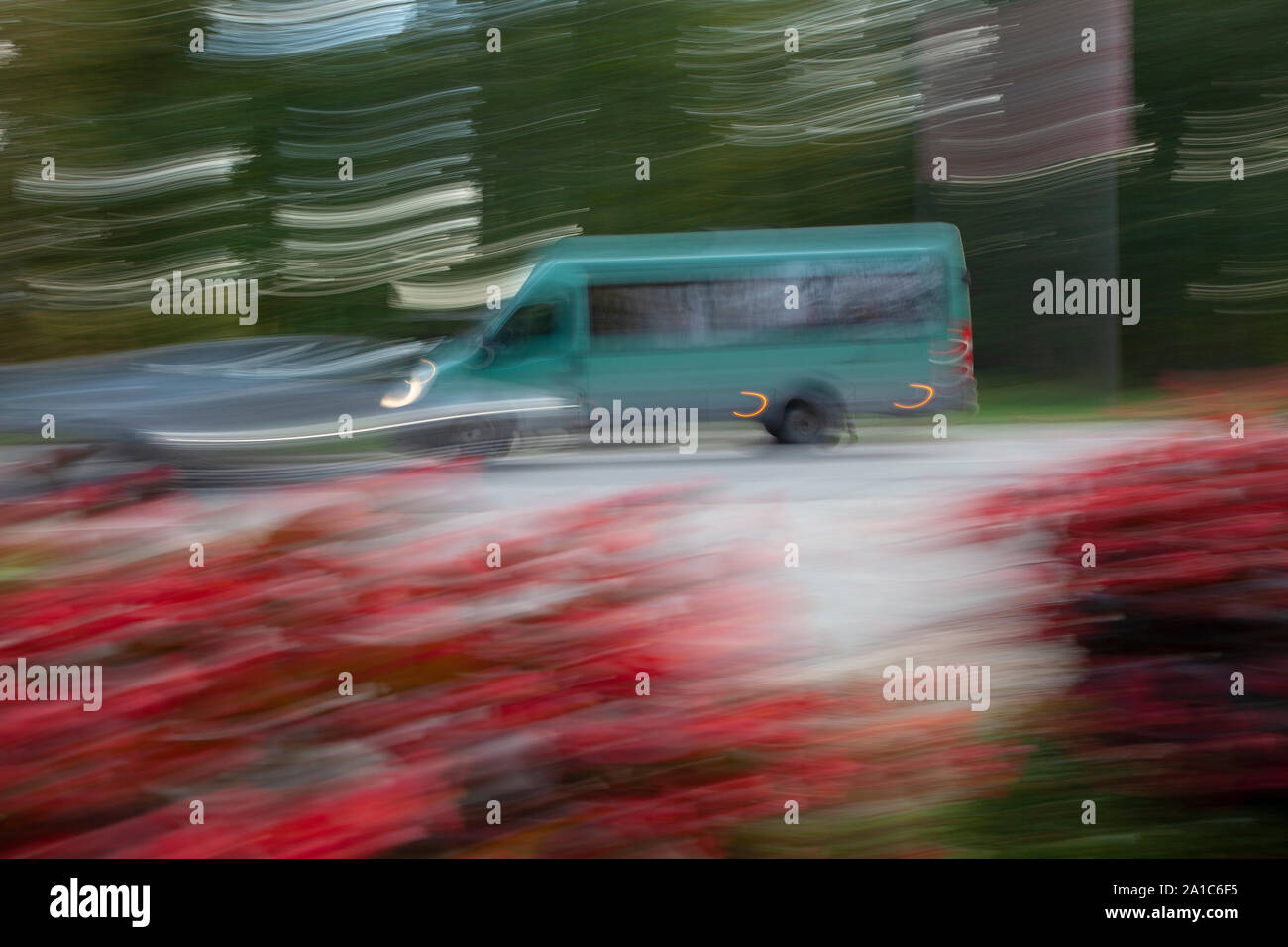Defocused bus from a left side in movement Stock Photo