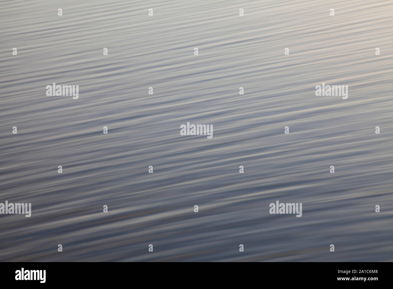 Blue to green gradient stripped wallpaper or background resembling a surface of water Stock Photo